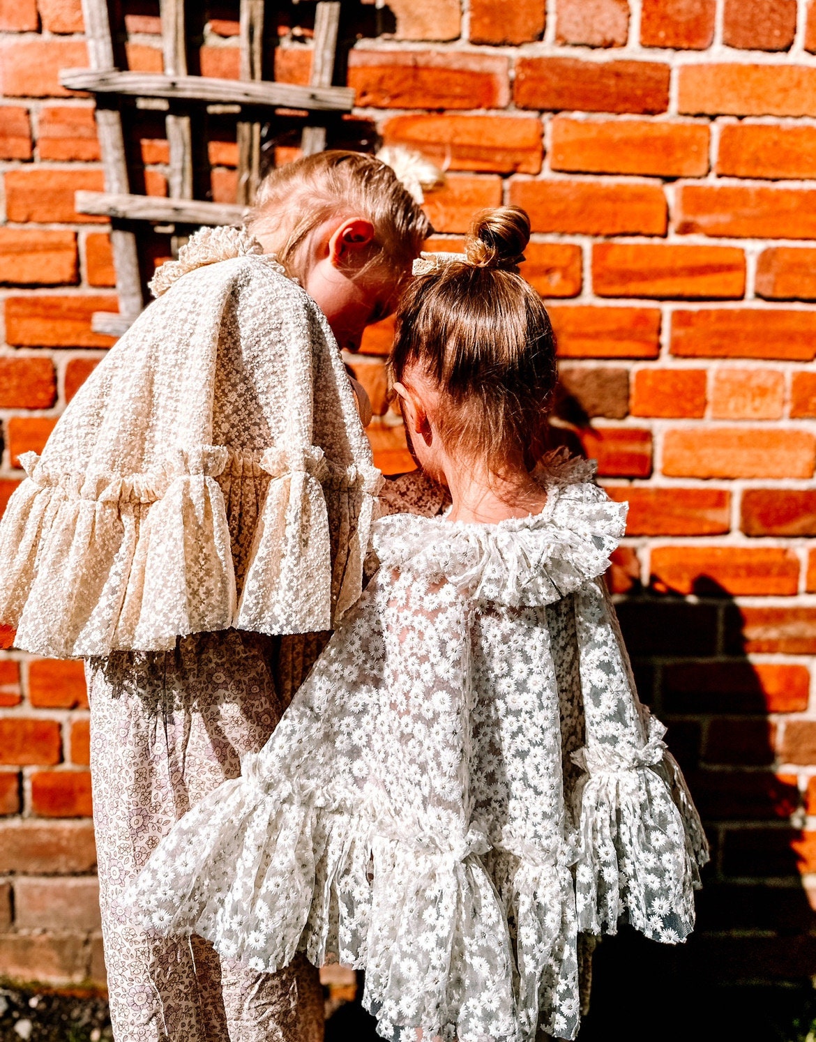 White embroidered daisy cape with frill