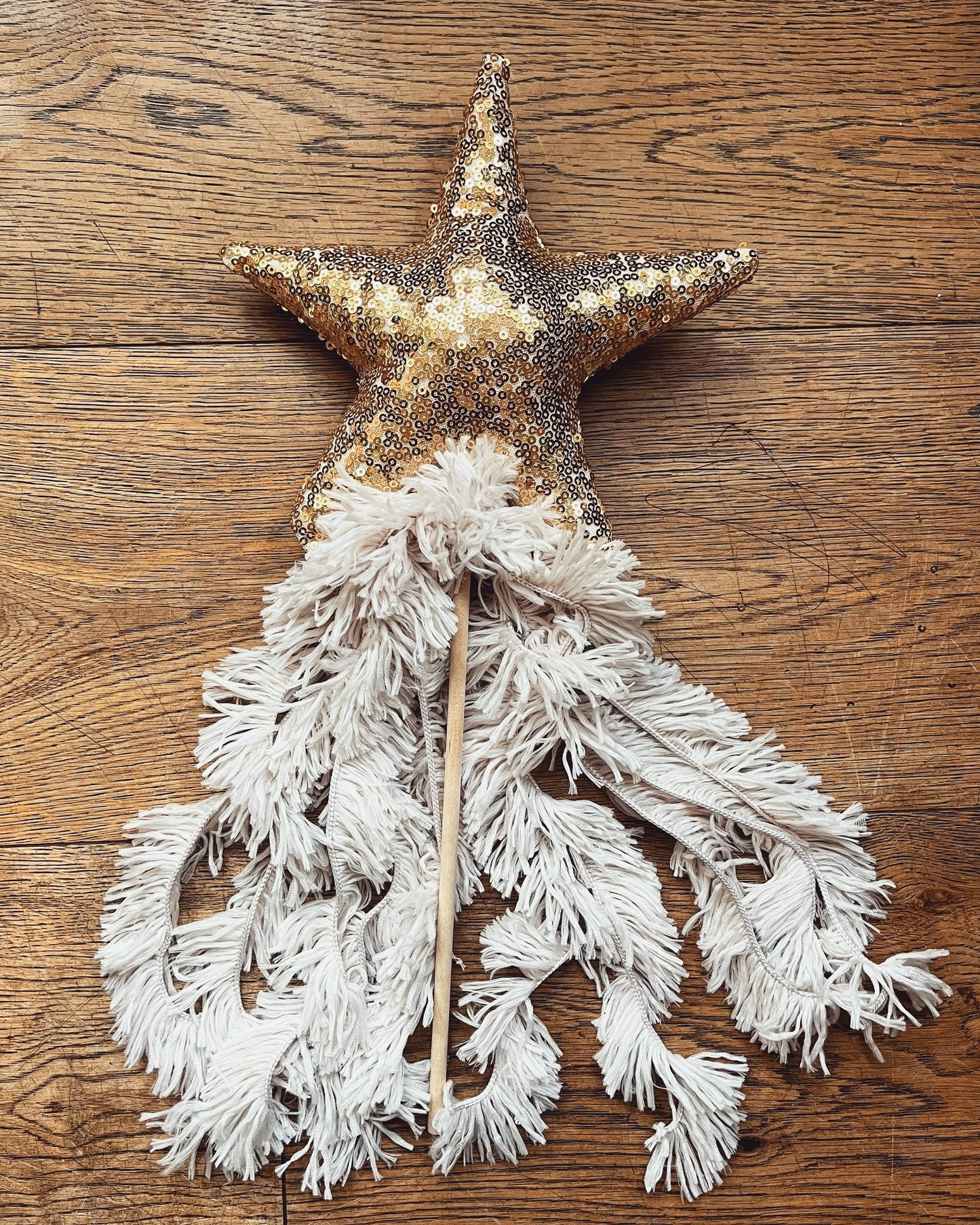 gold sequin wand with shaggy tassels