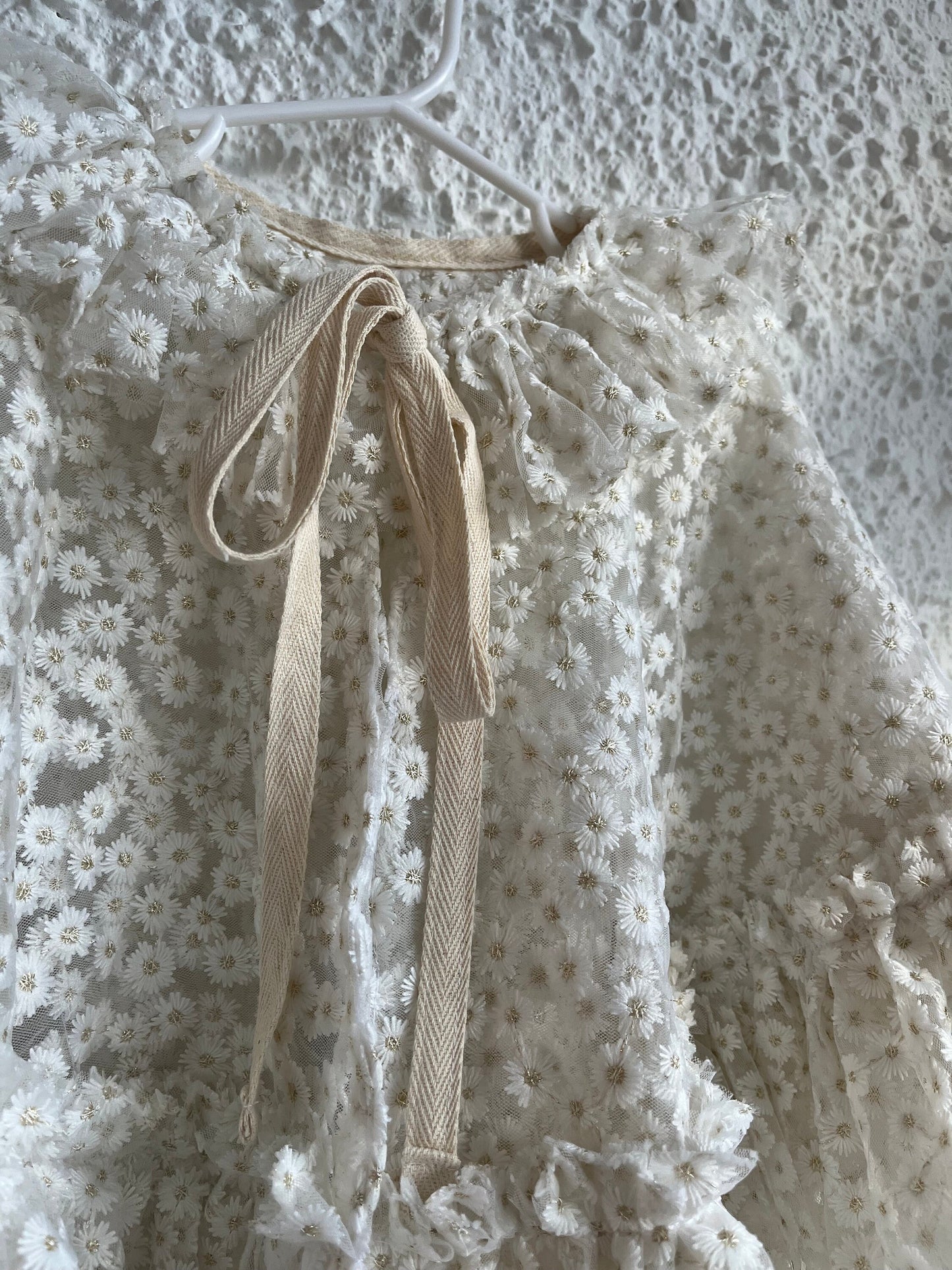 White embroidered daisy cape with frill