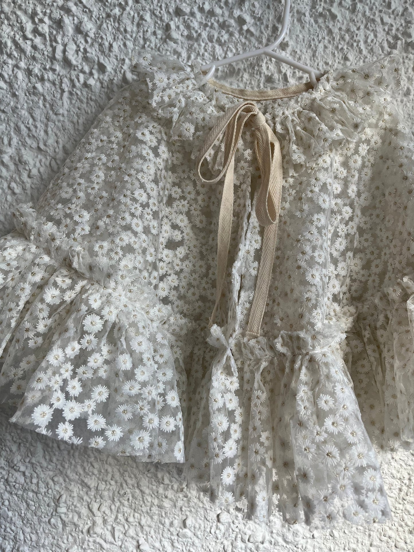 White embroidered daisy cape with frill