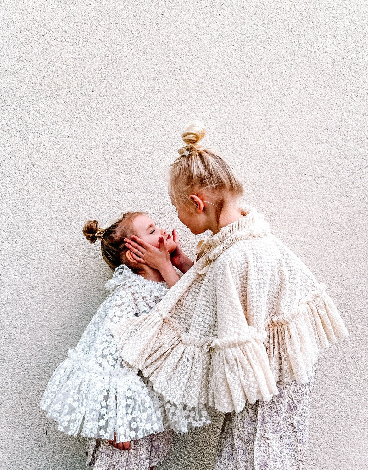 White embroidered daisy cape with frill