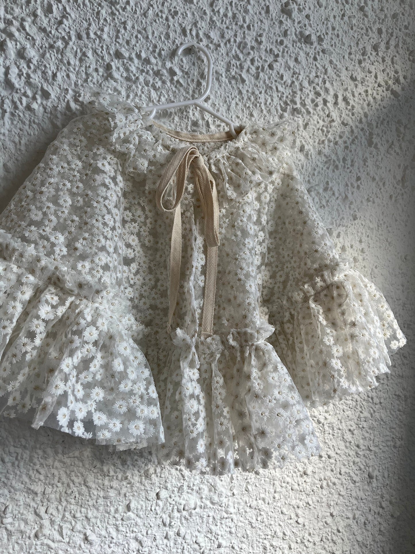 White embroidered daisy cape with frill
